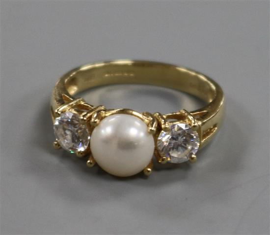 A 14ct gold, three stone cultured pearl and cubic zirconia dress ring, size O.